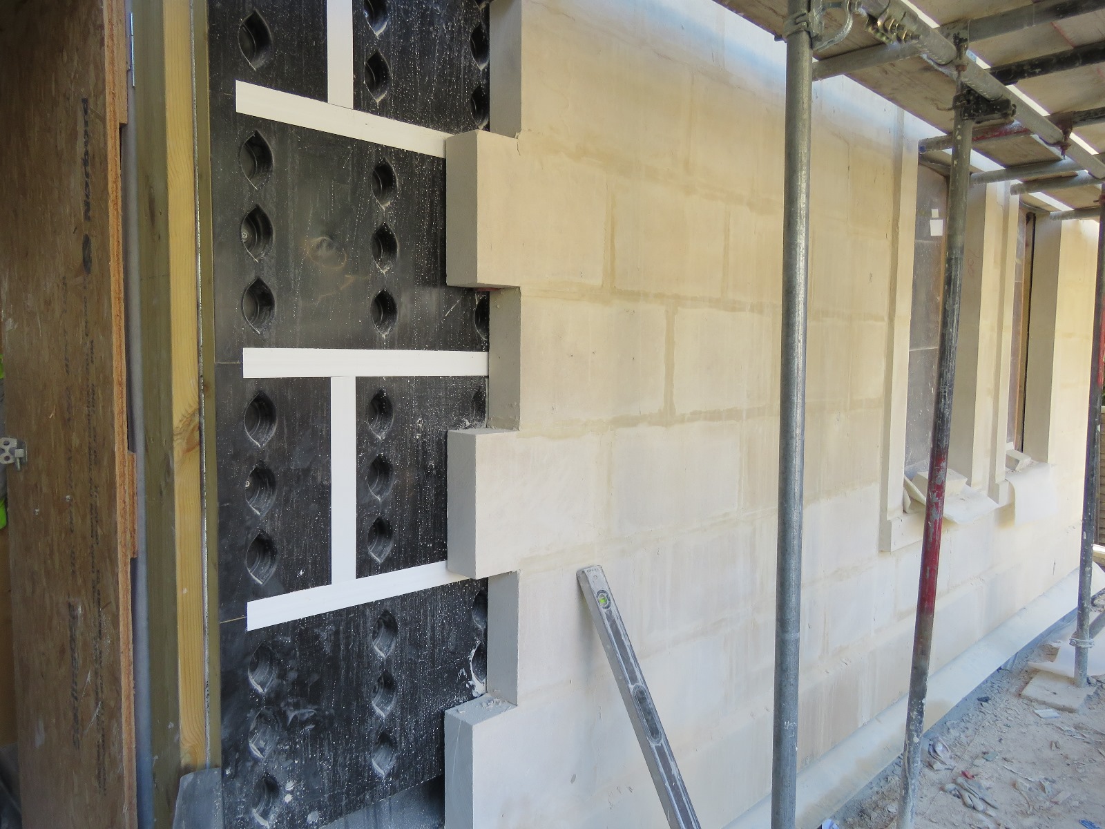 Bath ashlar stone used with surecav. Brick masonry finish with SureCav25 bba approved cavity spacer rainscreen system keeping clear, dry, vented moisture and mortar-free cavities guarenteed whilst protecting against wind-driven rain and avoiding water ingress issues easily