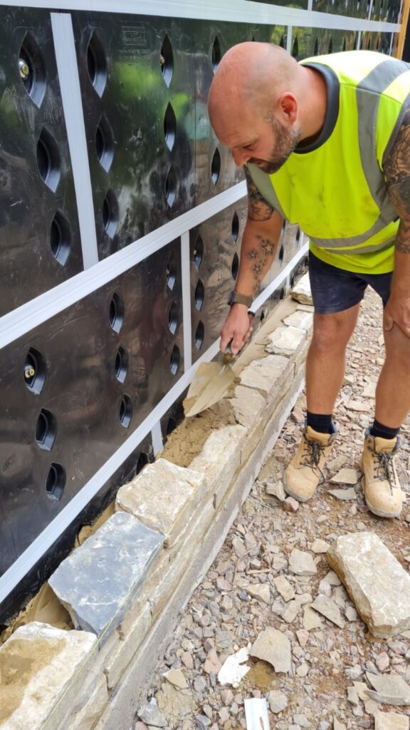 Builder laying bricks