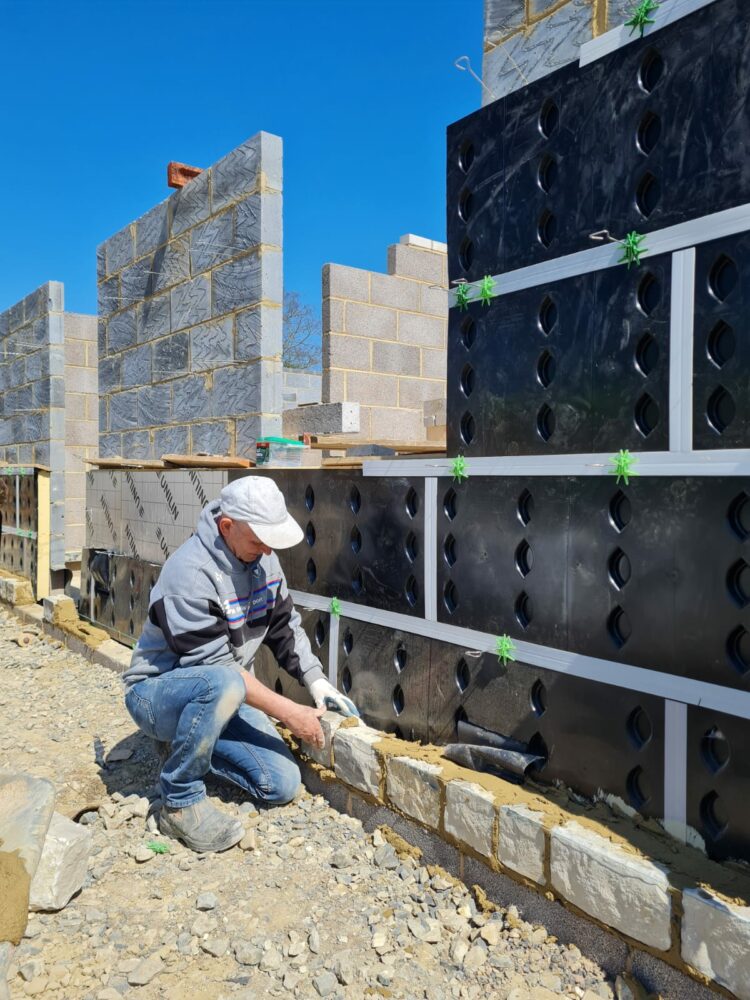 Masonry construction, against the SureCav BBA approved, cavity spacer, rainscreen system used with a partial fill insulation cavity.